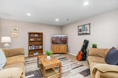 a living room with two couches and a guitar at The Rustic Retreat, Pet Friendly with Fenced Yard in Fort Collins