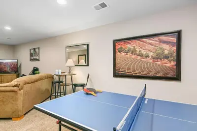 a living room with a ping pong table at The Rustic Retreat, Pet Friendly with Fenced Yard in Fort Collins