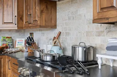a kitchen with pots and pans on a stove at Ridge View Retreat - Panoramic Views and Hot Tub in Nederland