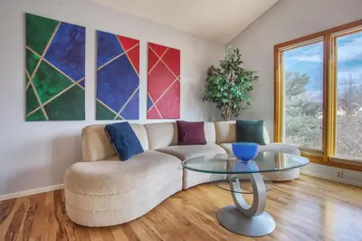 a living room with a couch and a glass table at 5 bedroom, 7 beds, 3 bath - Sleeps 12, Great for Families in Boulder