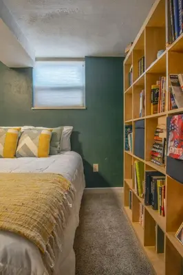 a bedroom with a bed and a book shelf at 5 bedroom, 7 beds, 3 bath - Sleeps 12, Great for Families in Boulder