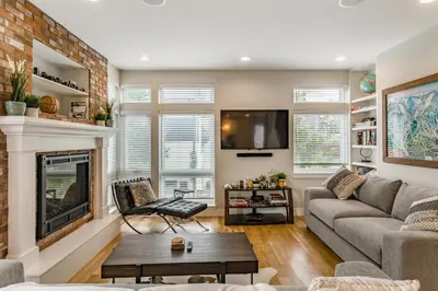 a living room with a couch and a fireplace at Luxury 5-Bedroom Home in LoHi in Denver