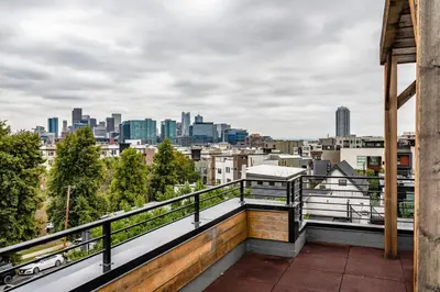 a balcony with a view of the city at Luxury 5-Bedroom Home in LoHi in Denver