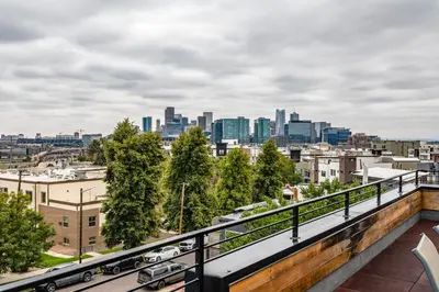 a view of a city skyline from a balcony at Luxury 5-Bedroom Home in LoHi in Denver