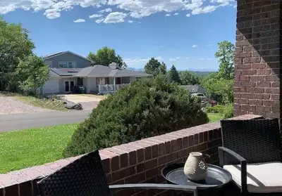 a vase sitting on a table on a patio at Epic Mntn views private hot tub and 420 friendly in Denver