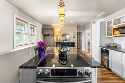 a kitchen with a stove with a tea kettle on it at Epic Mntn views private hot tub and 420 friendly in Denver