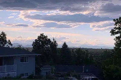 a house with a car parked in front of it at Epic Mntn views private hot tub and 420 friendly in Denver