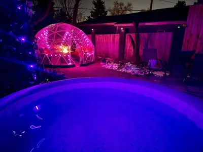 a backyard with purple lights and a igloo at Epic Mntn views private hot tub and 420 friendly in Denver
