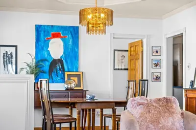 a dining room with a table and a chandelier at Epic Mntn views private hot tub and 420 friendly in Denver