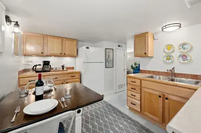 a kitchen with a sink and a counter top at Peterson Retreat - Hot Tub, Bikes, Old Town in Fort Collins