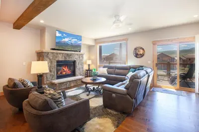 a living room with couches and a fireplace at Private Neighborhood Lake, Upscale Quality, 2 Living Rooms, Close to Raven Golf Club in Silverthorne