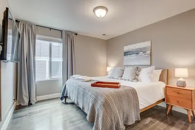 a bedroom with a large bed and a window at 5400sqft 6BR 5BA Theater, Office, Game Room in DEN
