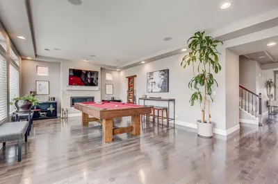 a living room with a pool table in it at 5400sqft 6BR 5BA Theater, Office, Game Room in DEN