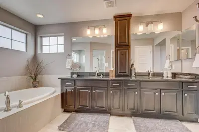 a bathroom with a tub and a sink and a bath tub at 5400sqft 6BR 5BA Theater, Office, Game Room in DEN