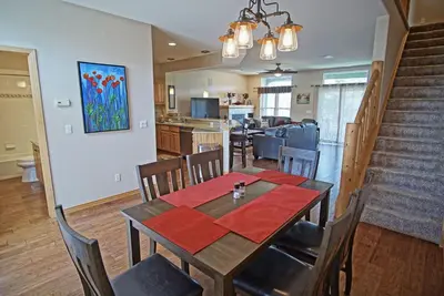 a dining room and kitchen with a table and chairs at Hot Tub, Blue River in Backyard, Close to 5 Ski Resorts, On Free Bus Route, New Listing in Silverthorne