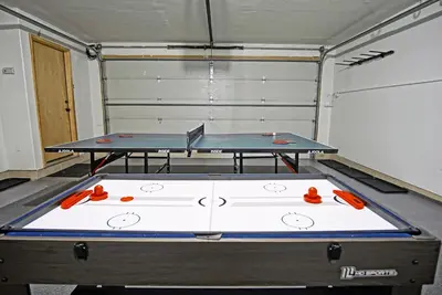 a ping pong table in a room with two tables at Hot Tub, Blue River in Backyard, Close to 5 Ski Resorts, On Free Bus Route, New Listing in Silverthorne