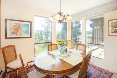 a dining room with a table and chairs and a window at Pool and Hot Tubs, On Lake Dillon, Beautiful Views in Dillon