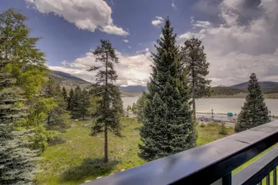 a view from a balcony of trees and a lake at Pool and Hot Tubs, On Lake Dillon, Beautiful Views in Dillon