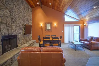 a living room with a couch and a dining room at Pool and Hot Tubs, On Lake Dillon, Beautiful Views in Dillon