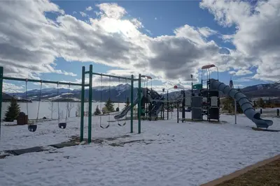 a playground with a slide in the snow at Pool and Hot Tubs, On Lake Dillon, Beautiful Views in Dillon