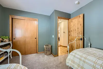 a bedroom with blue walls and a bed at Moon Creek Cabin cabin in Nederland