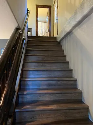 a staircase leading up to a home with wooden steps at Lux 3BR Home - Wildlife & Views near RMNP in Estes Park