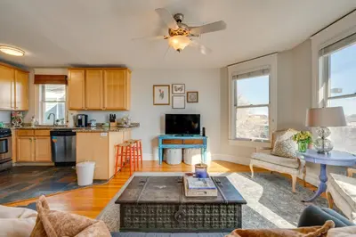 a living room with a couch and a table at 1 Mi to CU Boulder Condo Near Pearl Street! in Boulder
