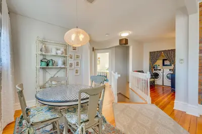 a kitchen and dining room with a table and chairs at 1 Mi to CU Boulder Condo Near Pearl Street! in Boulder