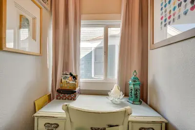a small table with a window in a room at 1 Mi to CU Boulder Condo Near Pearl Street! in Boulder