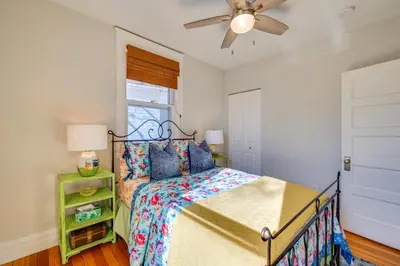 a bedroom with a bed and a ceiling fan at 1 Mi to CU Boulder Condo Near Pearl Street! in Boulder