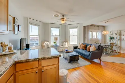 a kitchen and living room with a couch and a table at 1 Mi to CU Boulder Condo Near Pearl Street! in Boulder