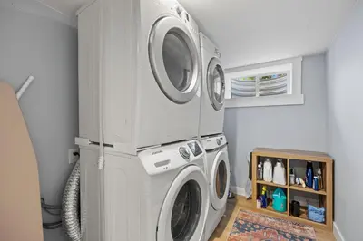 a laundry room with a washer and dryer at Urban Hideaway - 2BR - Pets OK - Park 2 Cars - Laundry - Fast WIFI - Close to Everything in Denver