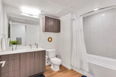 a bathroom with a toilet and a sink and a shower at My Sweet Rentals- 30 night min in Aurora