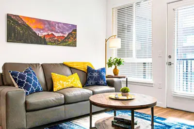 a living room with a couch and a table at My Sweet Rentals- 30 night min in Aurora