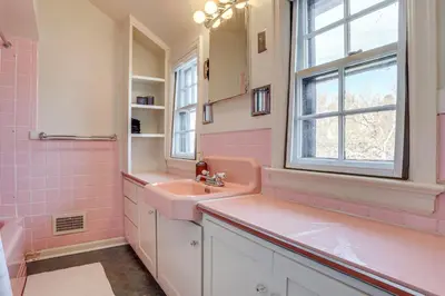 a pink bathroom with a sink and a window at Half-Mi to UNC Historic Dtwn Greeley Home in Greeley