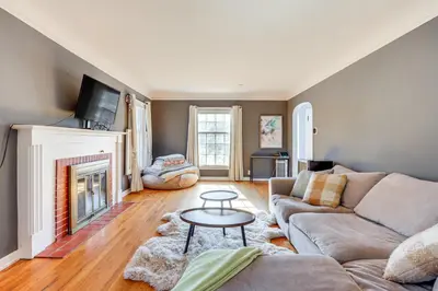 a living room with a couch and a fireplace at Half-Mi to UNC Historic Dtwn Greeley Home in Greeley
