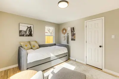 a bedroom with a bed in a room at Less Than 1 Mi to Olde Town Arvada Home with Patio! in Arvada