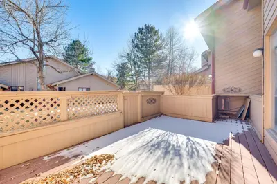 a balcony of a house with a wooden fence at 2 Mi to CU Boulder Townhome with Private Deck! in Boulder