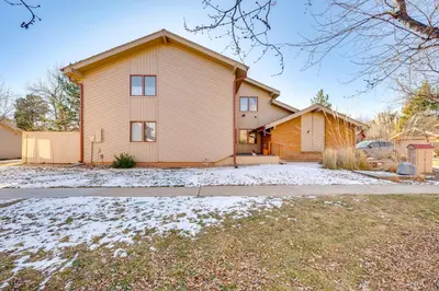 a house with a car parked in front of it at 2 Mi to CU Boulder Townhome with Private Deck! in Boulder