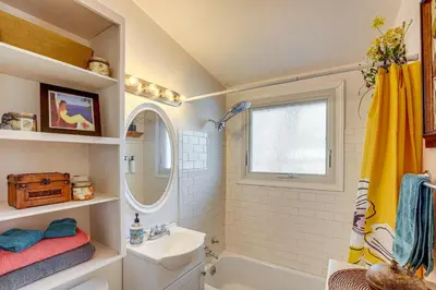 a bathroom with a sink and a toilet and a tub at 10 Mi to Red Rocks Denver Home with Fire Pit! in Denver