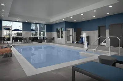 a large swimming pool in a hotel room at Hampton Inn & Suites By Hilton Wheat Ridge Denver West in Wheat Ridge