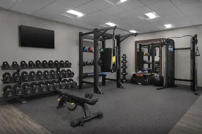 a fitness room with a lot of equipment in it at Hampton Inn & Suites By Hilton Wheat Ridge Denver West in Wheat Ridge