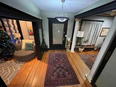 a living room with a christmasmas tree and a living room with a living at 4 BR Luxurious-Gem Mansion in Heart of Denver in Denver