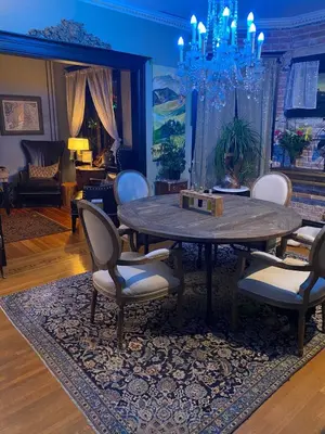 a dining room with a table and chairs at 4 BR Luxurious-Gem Mansion in Heart of Denver in Denver