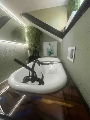 a bathroom with a white sink in a room at 4 BR Luxurious-Gem Mansion in Heart of Denver in Denver