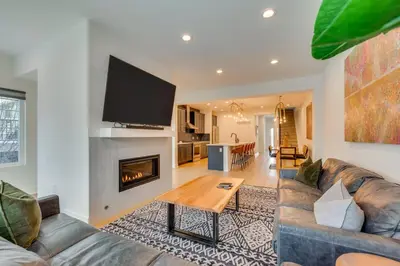 a living room with a couch and a table at 13 Mi to Boulder Family-Friendly Home in Erie! in Erie
