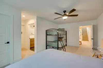 a bedroom with a bed and a ceiling fan at 13 Mi to Boulder Family-Friendly Home in Erie! in Erie