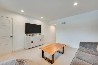 a living room with a couch and a tv at 13 Mi to Boulder Family-Friendly Home in Erie! in Erie