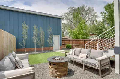 a patio with two couches and a table at 13 Mi to Boulder Family-Friendly Home in Erie! in Erie
