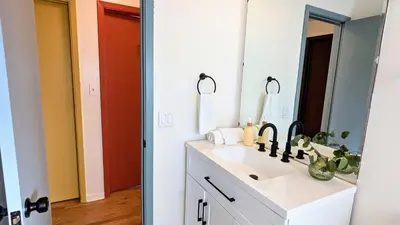 a bathroom with a sink and a mirror at Joy House in Golden